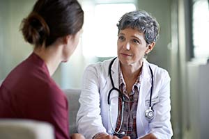 A women talking with her doctor